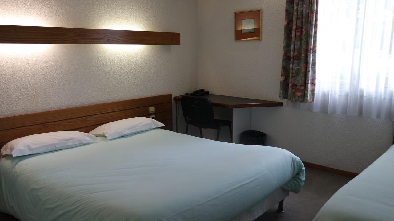 Hotel Le Tulipier Cransac Bagian luar foto